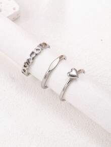 Set de 3 anillos de acero inoxidable con forma de corazón hueco en color plateado, anillos minimalistas lisos apilables, anillos elegantes y elegantes para mujeres - Plateado - Ver 7