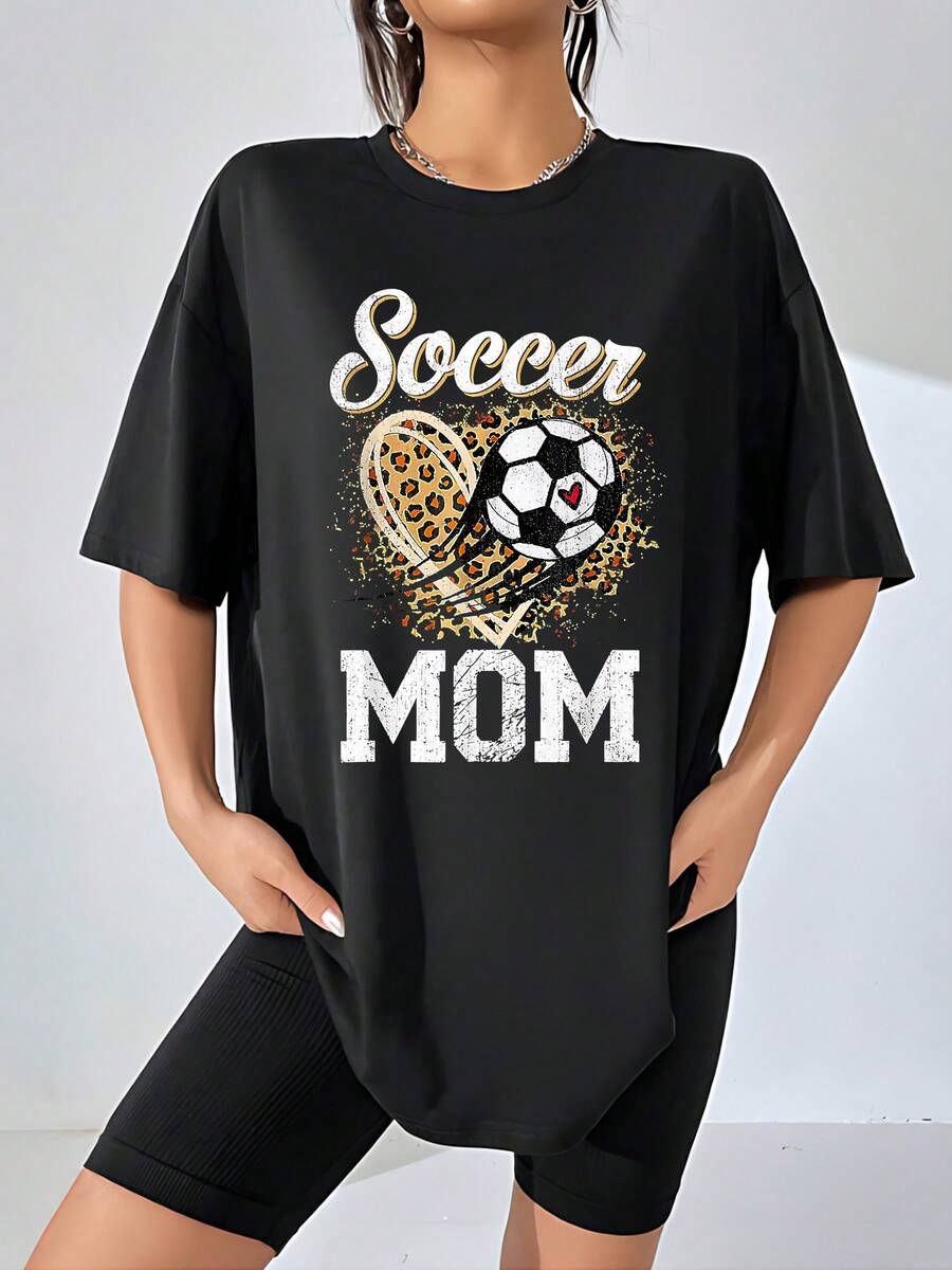 Heart With Leopard Print And Soccer Ball Symbolizing A Mother's Passion For Supporting Her Team And Family With Energy. Women's T-Shirts, 100% Cotton, Casual, Comfortable, Ideal For Everyday Wear And Sports. - Black - View 1