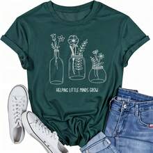 Camiseta para mujer, para maestras, con diseño gráfico de flores y plantas que ayuda a que las pequeñas mentes crezcan, manga corta. - Verde - Ver 6