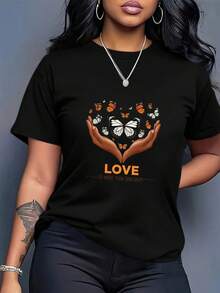 OversizeCamiseta vintage estampada para mujer de talla grande - blanca con la inscripción LOVE en naranja y diseño de mano en forma de corazón, estampado de mariposas, suave y ligera, estilo casual urbano, cuello redondo, manga corta, perfecta para primavera y verano, estilo de fin de semana, imprescindible para amantes de la moda, linda. - Negro - Ver 5