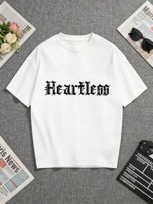 White T-Shirt With A Striking "Heartless" Print In Gothic Font. Perfect For Casual Wear Or As A Unique Gift For Loved Ones. A Short-Sleeved T-Shirt Suitable For Home, Everyday Wear, Parties, And Travel-Ideal As A Gift For Friends Or Family. - 白色 - 查看 1