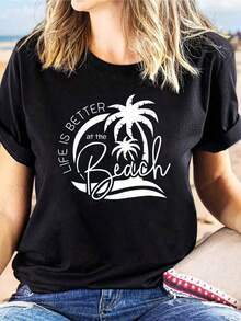 Camiseta de manga corta para mujer, talla grande, con estampado de cocotero y eslogan escrito a mano, diseño "LA VIDA ES MEJOR EN LA PLAYA", cuello redondo, estilo casual, para primavera/verano. Animado, Para, Al Aire Libre, Para Viajes Diarios, Versátil, Ropa Elegante 2026 - Esencial para un Verano Acogedor y Estilo Casual Chic de Ocio - Negro - Ver 1