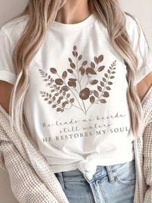 Women's White Cotton Christian T-Shirt (Sizes S-2XL) - Floral Design With Bible Verse And The Phrase "He Leads Me Beside Still Waters." Soft, Light-Colored Floral Design. Suitable For Everyday Wear At Church. Religious Gift For Women. Machine-Washable Faith Clothing. Devotional Wear. Inspirational Clothing. Exquisite Stitching. T-Shirt With Bible Verse. JVG2 - 白色 - 查看 1