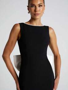 Vestido largo sin mangas de color negro y blanco con estilo de dama, nuevo modelo de primavera y verano 2026, estilo chica atrevida con espalda descubierta y lazo de perlas. - Negro - Ver 6