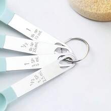 Bộ cốc và thìa đong định lượng, cốc và thìa xếp chồng lên nhau, cốc đong lồng vào nhau với tay cầm bằng thép không gỉ, dụng cụ nhà bếp dùng cho nấu nướng và làm bánh. - Nhiều màu - Xem 3
