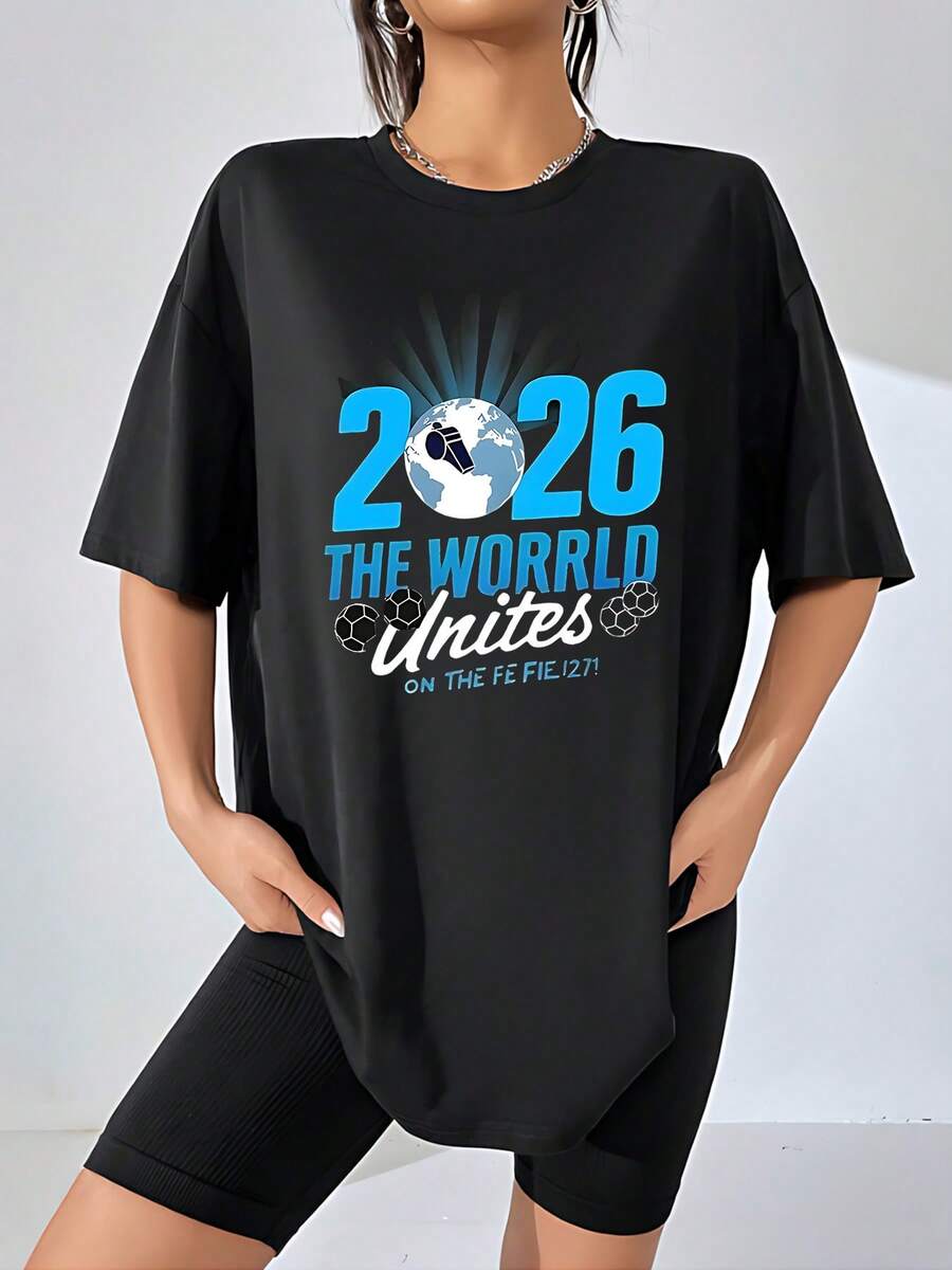 The Print Features The Number 2026 Alongside An Illuminated Planet Earth And Soccer Balls Symbolizing Global Unity Through Sport, With A Positive Message About Human Connection And International Celebration. This Women's T-Shirt Is 100% Cotton, Comfortable And Soft, Ideal For Everyday Wear And Casual Occasions. - 黑色 - 查看 1