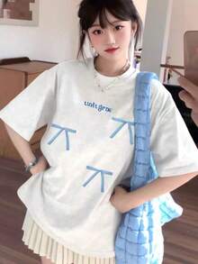 Camiseta de verano 2026 con diseño de lazo de manga corta, estilo americano, rejuvenecedora y adelgazante, nueva blusa holgada estilo Mori. - Camisa negra de manga corta con un lazo rosa. - Ver 2