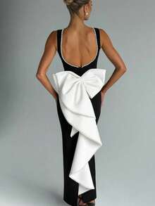 Vestido largo sin mangas de color negro y blanco con estilo de dama, nuevo modelo de primavera y verano 2026, estilo chica atrevida con espalda descubierta y lazo de perlas. - Negro - Ver 4