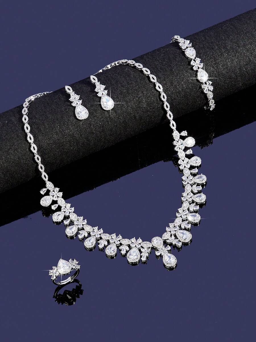 A Set Of Elegant And Minimalist Jewelry For Ladies, Including A Drop-Shaped Cubic Zirconia Necklace, Earrings, Bracelet And Ring. Suitable For Both Daily Wear And Formal Occasions. - B0473-r4S - View 1