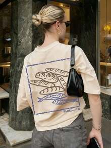 Women's Round Neck Printed Short Sleeve T-Shirt, Casual Loose Fit, Super Soft & Comfortable Fabric, Ins Street Fashion Style, Classic All-match Graphic Tee, Breathable Lightweight Daily Basic Top, Perfect for Daily Wear, Casual Vacation, Office Commute, Outdoor Going Out, Weekend Gathering, Shopping and Leisure Activities, Ladies Trendy Oversized Casual Pullover T-Shirt - Albaricoque - Ver 2