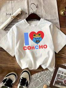 Camiseta Blanca con Divertido Diseño de Rana de Dibujos Animados Sosteniendo una Cámara y un Corazón Rojo, con la Palabra "Concho" - Estilo Casual Único, Perfecta para Amantes de la Fotografía y la Moda, Ideal para Verano y Actividades al Aire Libre, Camiseta Y2k - Blanco - Ver 1