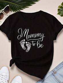 blusas Camiseta de Anuncio de Embarazo para Mujer - "Futura Mamá" con Huellas - Camiseta de Maternidad Suave y Elástica - Corte Holgado, Cuello Redondo, Manga Corta - Perfecta para Fiestas de Revelación de Género y Baby Showers - Ropa de Embarazo Casual y Cómoda - Estilo Retro con Patrón Geométrico - Lavar a Mano, Lavar en Seco - Silueta H - Uso en Todas las Temporadas - Moda Femenina, Tela Transpirable, Para Futuras Mamás 220g - Negro - Ver 1
