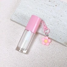1 cái hộp đựng son bóng rỗng 6ml màu hồng, trắng, tím, xanh lá cây, xanh dương, có cọ lớn, kèm ống đựng son bóng và dầu dưỡng môi, có móc khóa hình hoa. - Nhiều màu - Xem 11