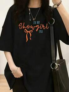 Camiseta de manga corta para mujer estilo retro de los 80s vintage de showgirl - con el eslogan "IN MY Showgirl ERA", lazo naranja y letras cursivas, corte holgado, cuello redondo, blusa de manga corta para fiestas temáticas de los 80s, bailes de graduación, atuendos casuales de verano - fuente escrita a mano y colores pastel, camisetas gráficas para mujer, camisetas casuales para mujer, camisetas divertidas para mujer, camisetas gráficas para mujer, ropa de mujer para el verano, camiseta de mujer, camisetas gráficas para mujer, camisetas lindas para mujer, camiseta con estampado gráfico para mujer, tops lisos para mujer, camisetas estampadas de ocio. - Negro - Ver 7