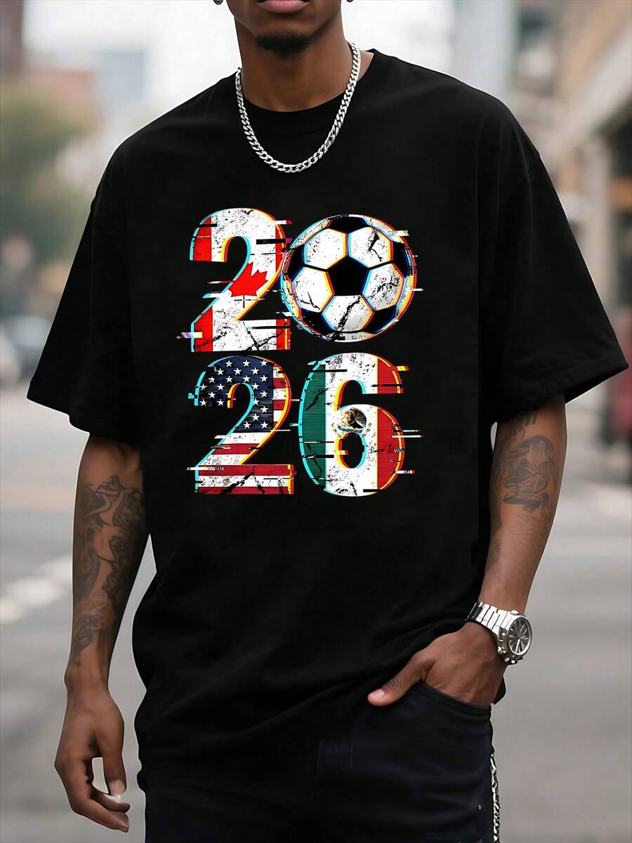 The Graphic Shows The Number 2026 With A Soccer Ball In The Center Surrounded By Flags Representing The Union Of Host Countries And Symbolizing Passion For The Sport, International Celebration, And The Energy Of The Fans. Men's T-Shirt - 黑色 - 查看 1