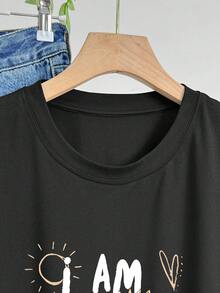 Camiseta Oversize para Mujer - Blanca con Letras Negras Gruesas - Corte Holgado para Uso Diario Casual - Camiseta de Cuello Redondo con Elasticidad Media para Atuendos Cotidianos y Formales - Ropa Cómoda para Mujer para Todas las Temporadas, Camisetas para Damas, Ropa Versátil, Camiseta con Estampado Gráfico, Material No Transparente, Atuendo Relajado, Diseño Minimalista, Tela Transpirable, Camiseta de Manga Corta, Camiseta Y2k para Amantes de la Moda - Negro - Ver 5