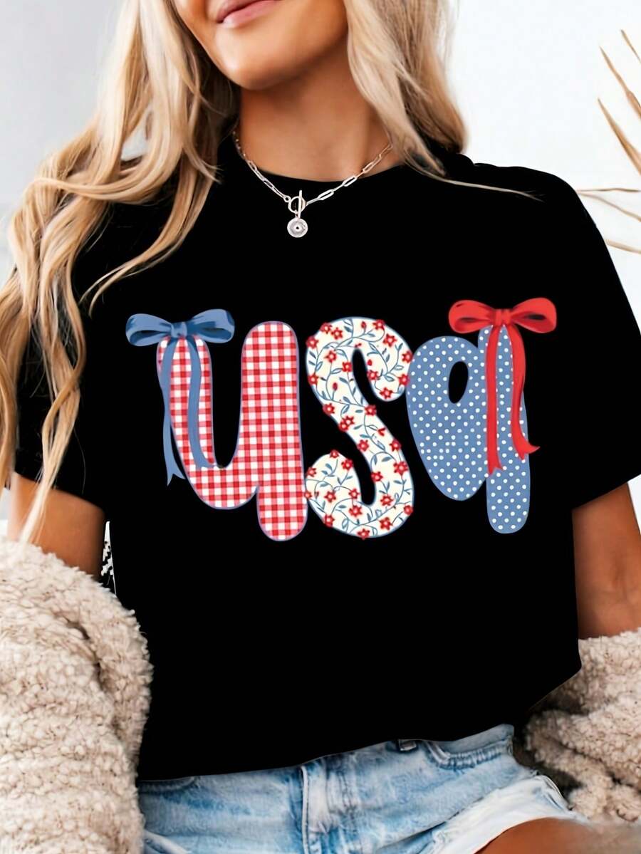 Camiseta Patriótica con Bandera Americana para Mujer 2026 - Diseño floral de estrellas y rayas con detalles de lazo a cuadros, top casual de manga corta con cuello redondo en rojo, blanco y azul, adecuada para el 4 de julio, el Día del Trabajo, el Día de Acción de Gracias y Halloween - Ropa casual cómoda, un regalo ideal tanto para hombres como para mujeres (lavable a máquina). L2RD - Negro - Ver 1