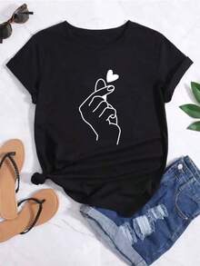 Camiseta casual de manga corta para mujer, con un estampado contrastante de líneas y formas de corazón.Patrón en forma de corazón, sencillo, elegante y versátil. - Negro - Ver 6