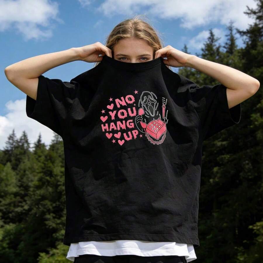 Ropa de verano para mujer, camiseta de algodón suave y casual con cuello redondo, estampado de cara de fantasma con la frase "No You Hang Up". Color blanco. - Negro - Ver 1