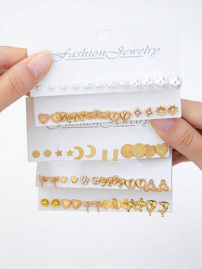 Conjunto de aretes encantadores para mujer con elementos minimalistas y elegantes de perla falsa/corazón/flor/luna/estrella/insecto/animal, diseño de nicho adecuado para uso diario de la mujer