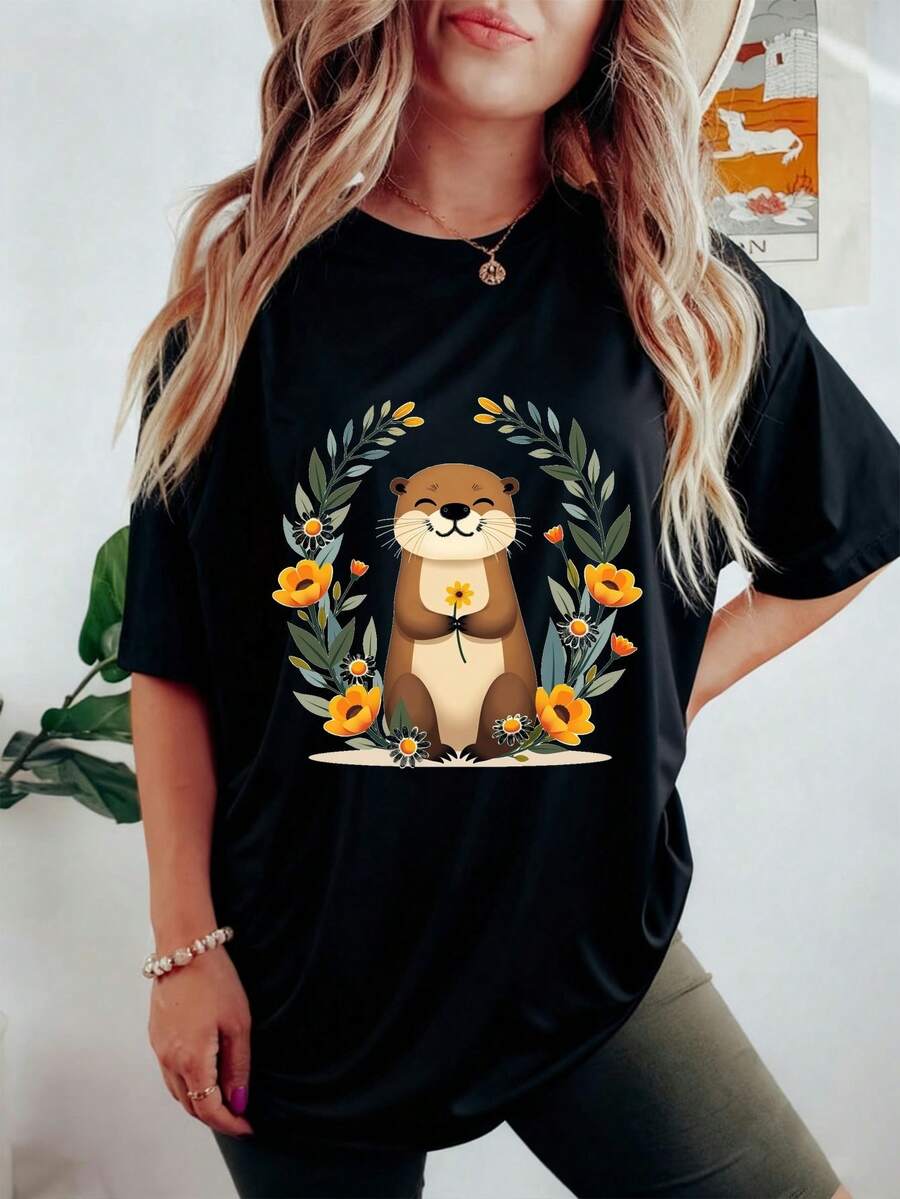 Camiseta de manga corta de verano 2026 de las mujeres, encantadora lontra sonriente y flor silvestre jardín tee gráfica, estilo minimalista Cottagecore Boho francés, suave transpirable toda la temporada para vacaciones en la playa en el hogar