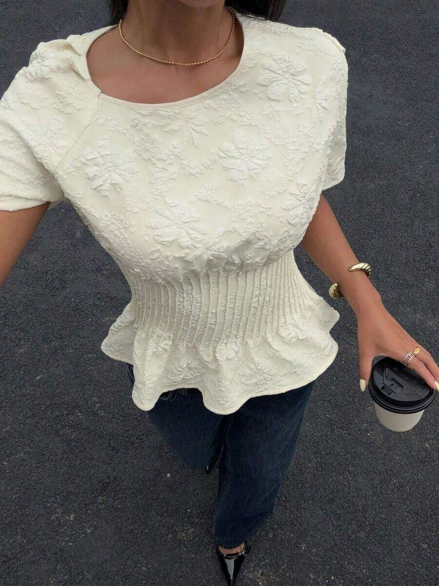 Elegante blusa de verano con textura floral, de color crema apricot, para mujer. Apta para uso casual en el trabajo, fiestas y eventos. Camisa con espalda anudada y cintura fruncida, de manga corta y diseño jacquard, con estilo y elegancia. - Albaricoque - Ver 1