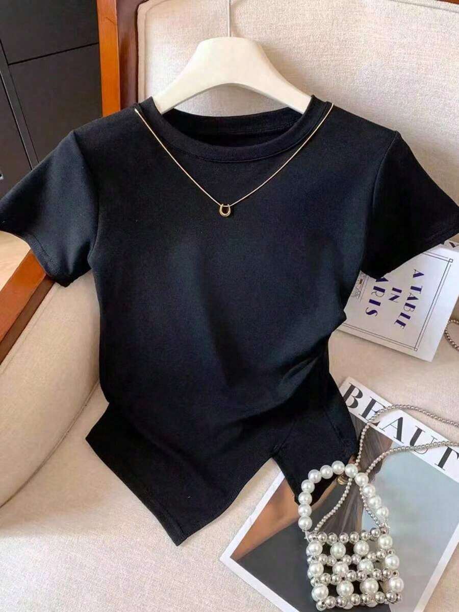 Camiseta casual de mujer de unicolor, cuello redondo, manga corta con bajo asimétrico - Negro - Ver 1