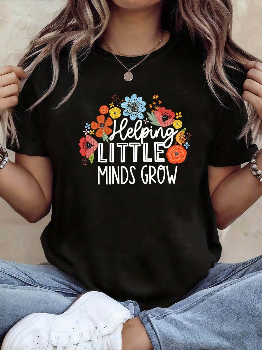 Ayudando a que las mentes jóvenes crezcan con una camiseta de manga corta de algodón holgada unisex de estilo vintage urbano, con estampado floral colorido, cuello redondo, cómoda y a para mujer, para la primavera y el verano. Ropa sencilla y única para mujer, perfecta para la escuela, el trabajo, los desplazamientos diarios, reuniones de profesores y atuendos suaves. - Negro - Ver 1