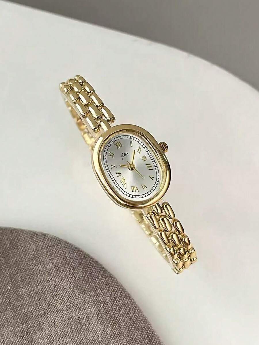 1 chiếc đồng hồ nữ cổ điển tối giản chạy bằng pin thạch anh, đồng hồ nữ sang trọng hình bầu dục nhỏ màu vàng, có mặt số hình bầu dục với chữ số La Mã và dây đeo bằng thép, đồng hồ thạch anh vàng dành cho nữ. Sự kết hợp màu sắc nhẹ nhàng và trang nhã được phối cùng các chữ số La Mã cổ điển. - Vàng - Xem 1