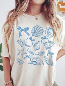 Camiseta vintage de talla grande para mujer con cuello redondo - Diseño de conchas azules, estrellas de mar y lazos, estilo casual de manga corta para playa con un diseño sencillo, lavable a máquina para comodidad durante todo el año, blusa linda, moda diaria, temática playera, tela suave, estilo simple. - Albaricoque - Ver 6