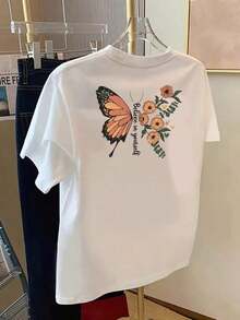 1 pieza de camiseta para mujer con estampado de mariposa "Believe In Yourself" - Camiseta de manga corta y cuello redondo con diseño motivacional en la parte delantera y trasera, tela de elasticidad media adecuada para uso casual en primavera, verano y otoño, lavable a máquina, blusa diaria, tela transpirable, estilo vintage-casual unisex, camiseta de algodón holgada de manga corta y cuello redondo, blusas para mujer. blusas.blusas casuales para dama. - Blanco - Ver 2