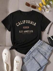 Nueva llegada 2026: camiseta de manga corta con cuello redondo para mujer. Hecho de 100% algodón puro con un corte holgado. Diseño casual y versátil con estampados, una prenda esencial en el armario. Perfecto para el transporte diario, citas informales y moda urbana. - Negro - Ver 3