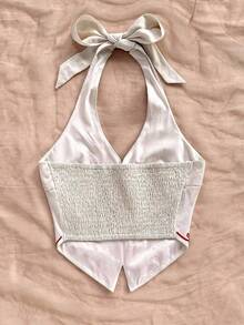 Top corto para mujer estilo bohemio sin mangas con diseño de espalda de tirantes, cuello halter con diseño anudado y bordados florales, adecuado para festivales de música - Albaricoque - Ver 8