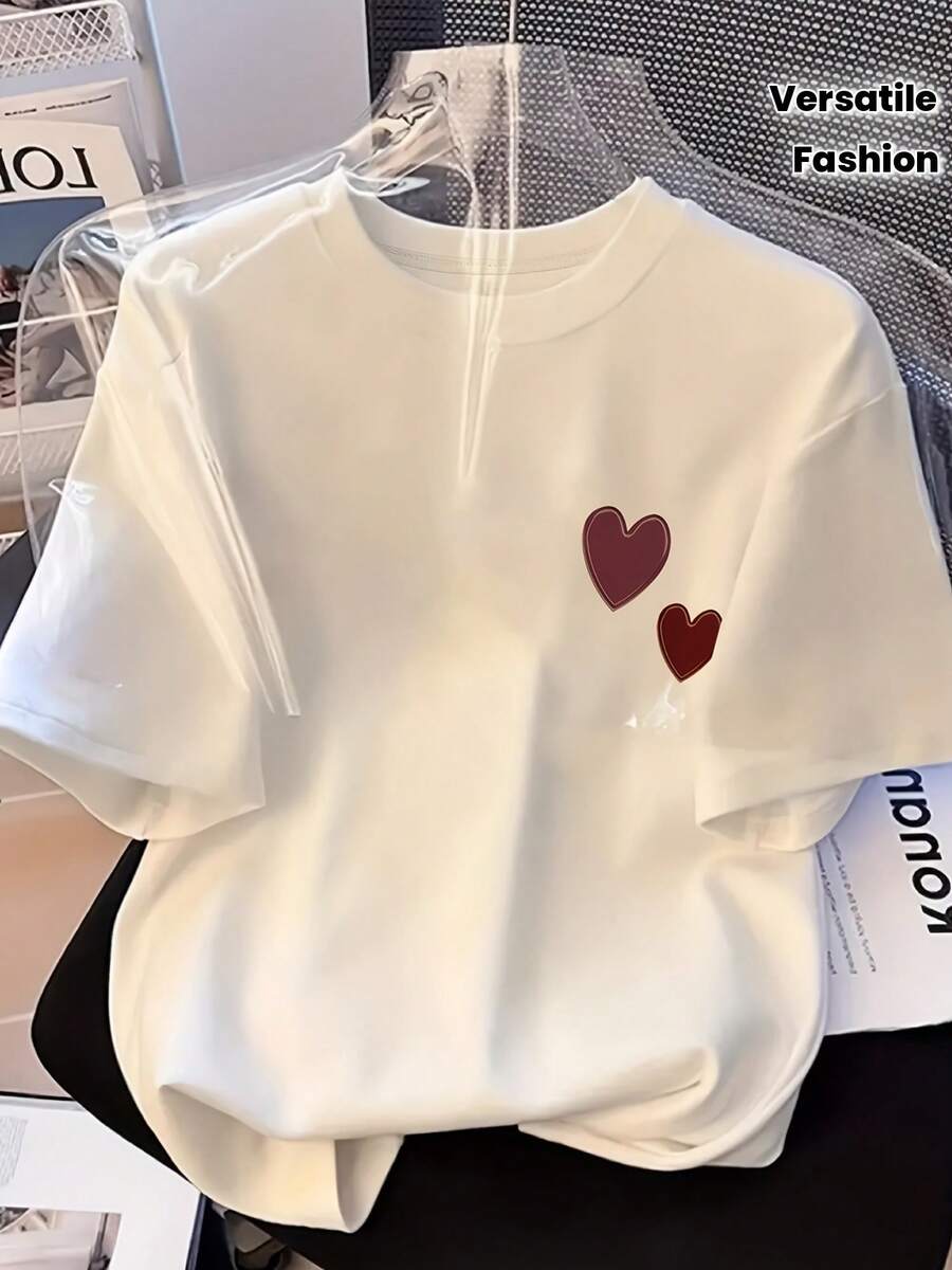 Camiseta de manga corta para mujer, de cuello redondo, holgada y a la moda, con estampado de corazón, versátil, color blanco.| Estilo casual, cuello redondo, tela ligeramente elástica, patrón geométrico, camisetas de primavera y verano. - Blanco - Ver 1
