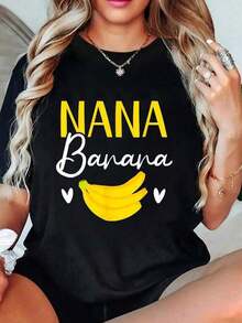 Mujer Camiseta de manga corta con estampado térmico de letras y plátanos en tonos amarillo y blanco, diseño de plátanos y corazones divertido, cuello redondo versátil - Negro - Ver 1
