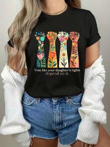 Playera minimalista moderna para mujer, cuello redondo, estampado floral de manos, con la frase "Vote Like Your Daughters Rights Depend On It", manga corta, informal, para uso diario. - Negro - Ver 6