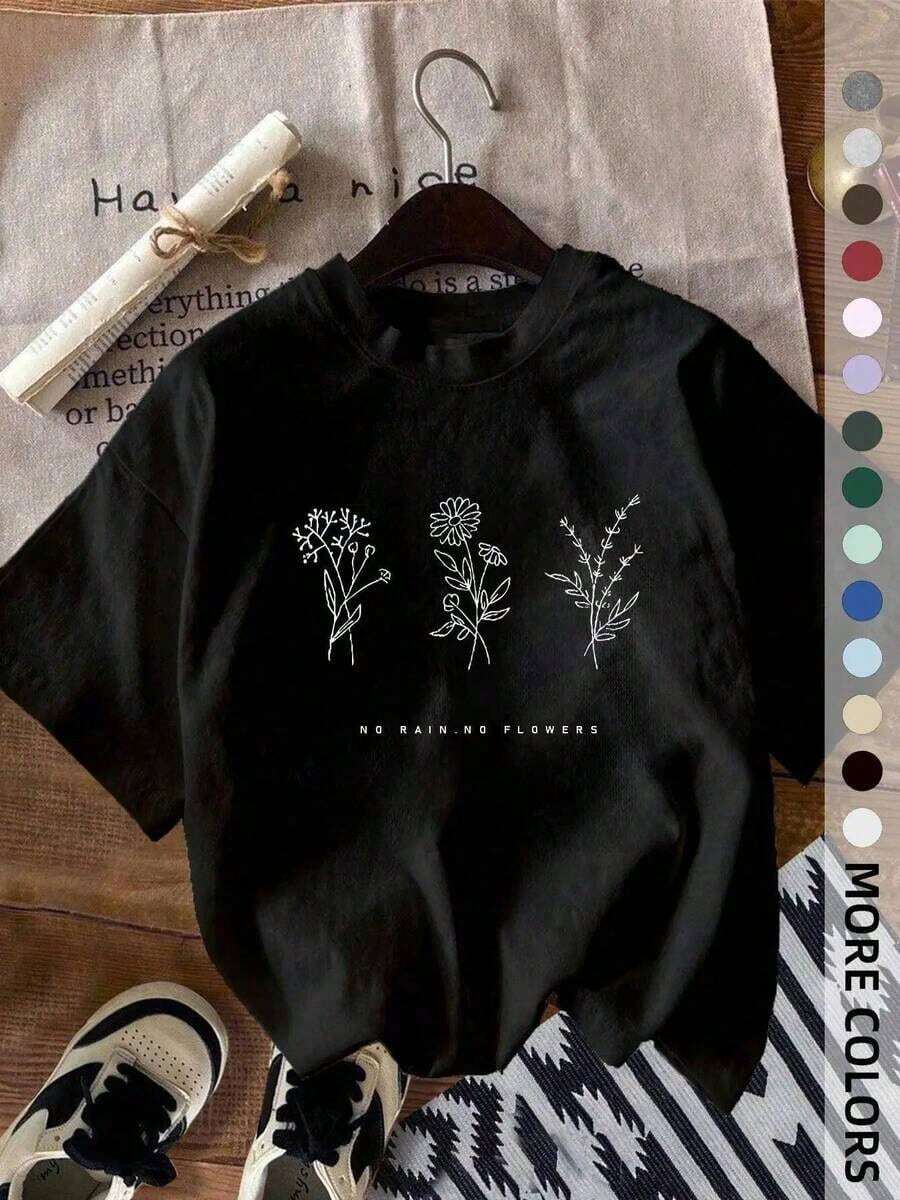 Camiseta con Estampado Gráfico de Flores Silvestres "No Rain No Flowers", Camiseta Minimalista con Arte Botánico Lineal, Camiseta Oversize [% Algodón], Top Casual de Manga Corta con Estampado Floral Bohemio, Camiseta Vintage Minimalista de Algodón para Uso Diario y Regalos para Amantes de las Plantas - Negro - Ver 1