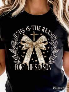 Camiseta navideña "Jesús es la razón", coqueta con lazo dorado, para mujeres fieles. Camiseta unisex de algodón puro de 220 g, peso ideal para todas las estaciones, apta tanto para hombres como para mujeres. Tejido duradero de alta calidad, suave al tacto y de larga duración. Top transpirable. Adecuado para la primavera y el verano de las mujeres, vacaciones, Día de la Madre, Día de la Independencia. - Negro - Ver 1