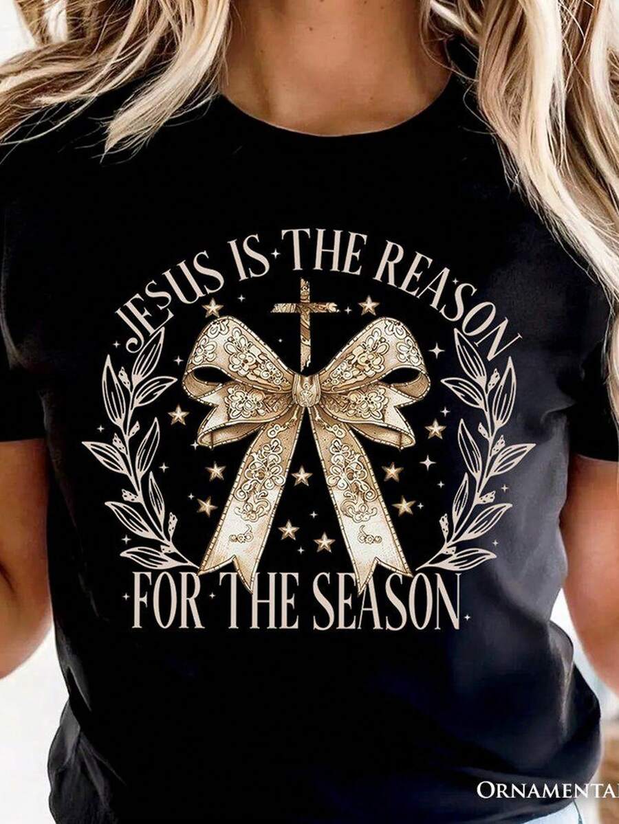 Camiseta navideña "Jesús es la razón", coqueta con lazo dorado, para mujeres fieles. Camiseta unisex de algodón puro de 220 g, peso ideal para todas las estaciones, apta tanto para hombres como para mujeres. Tejido duradero de alta calidad, suave al tacto y de larga duración. Top transpirable. Adecuado para la primavera y el verano de las mujeres, vacaciones, Día de la Madre, Día de la Independencia. - Negro - Ver 1