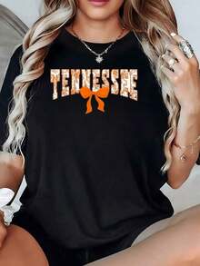 Estampado con la palabra TENNESSEE y un lazo naranja que simboliza energía optimismo y encanto femenino camiseta para mujer de 100% algodón suave y cómoda para uso diario - Negro - Ver 2
