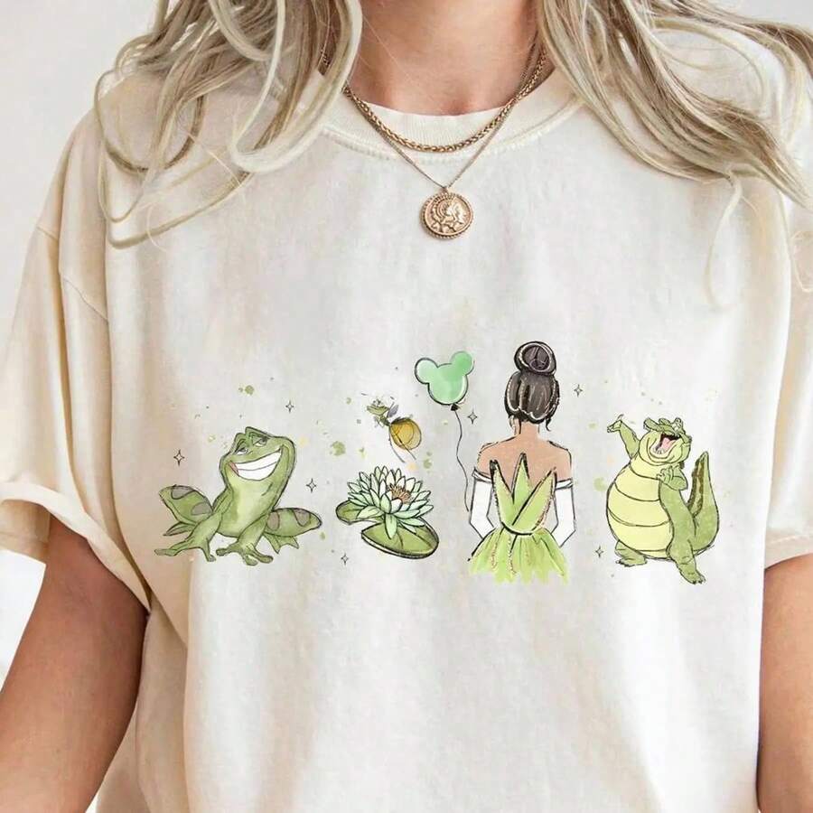 Camiseta de mujer de La Princesa Tiana y el Sapo: Conjunto oficial de la familia de princesas, con diseño de Tiana y una rana verde, color beige, apta para toda la familia, camiseta de manga corta, informal y versátil. - Blanco - Ver 1