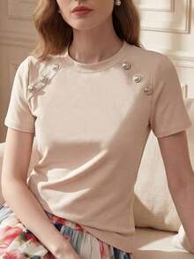 Camiseta ajustada de mujer de manga corta con cuello redondo y decoración de botones en color albaricoque, adecuada para uso diario, casual y versátil, top casual de verano para mujer con botones - Albaricoque - Ver 1