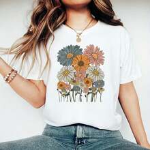 Camiseta de algodón para mujer, tallas 0XL-5XL, negra, de manga corta y cuello redondo, con estampado de margaritas coloridas, camiseta gráfica de corte holgado informal para el verano, camiseta casual con estampado floral, camiseta básica de algodón cómoda para mujer. - Blanco - Ver 1