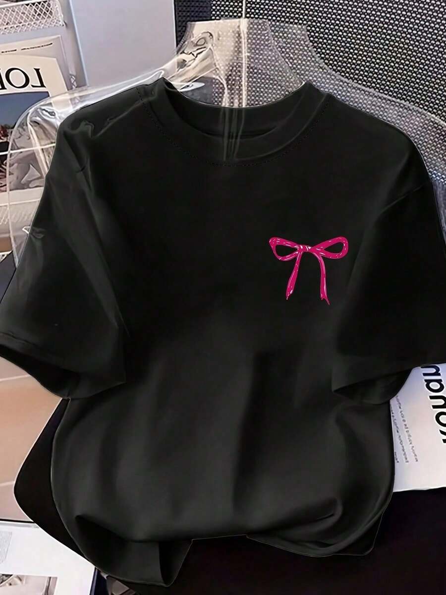 Camiseta de Mujer, Camiseta Casual de Talla Grande para Mujer con Estampado y Cuello Redondo, Ilustración de Lazo Rosa, Camiseta Estampada Adecuada para Uso Diario, Actividades al Aire Libre, Ocasiones Casuales y Festivas. Tops para Mujer - Negro - Ver 1