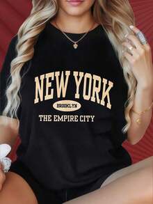 Camiseta de mujer con cuello redondo y mangas cortas, divertida para estampar. Camiseta de mujer con cuello redondo y mangas cortas, divertida para estampar. Camiseta negra de Nueva York, Brooklyn, la ciudad del imperio, para mujer, estilo casual, de gran tamaño, con estampado gráfico, top de moda urbana, adecuada para fiestas de Navidad, actividades deportivas, salidas de vacaciones, deportes y otros regalos festivos (220g). Adecuado para fiestas navideñas, actividades deportivas, fiestas de vacaciones, salidas, deportes y otros regalos navideños (220g). Playera - Negro - Ver 1