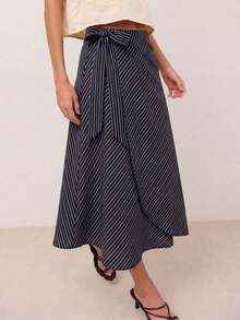 Falda midi envolvente con rayas diagonales, cierre lateral con lazo y bajo asimétrico.Silueta fluida con un drapeado favorecedor, perfecta para looks de primavera y verano, estilo casual chic y uso diario sin esfuerzo. - Verde militar - Ver 10