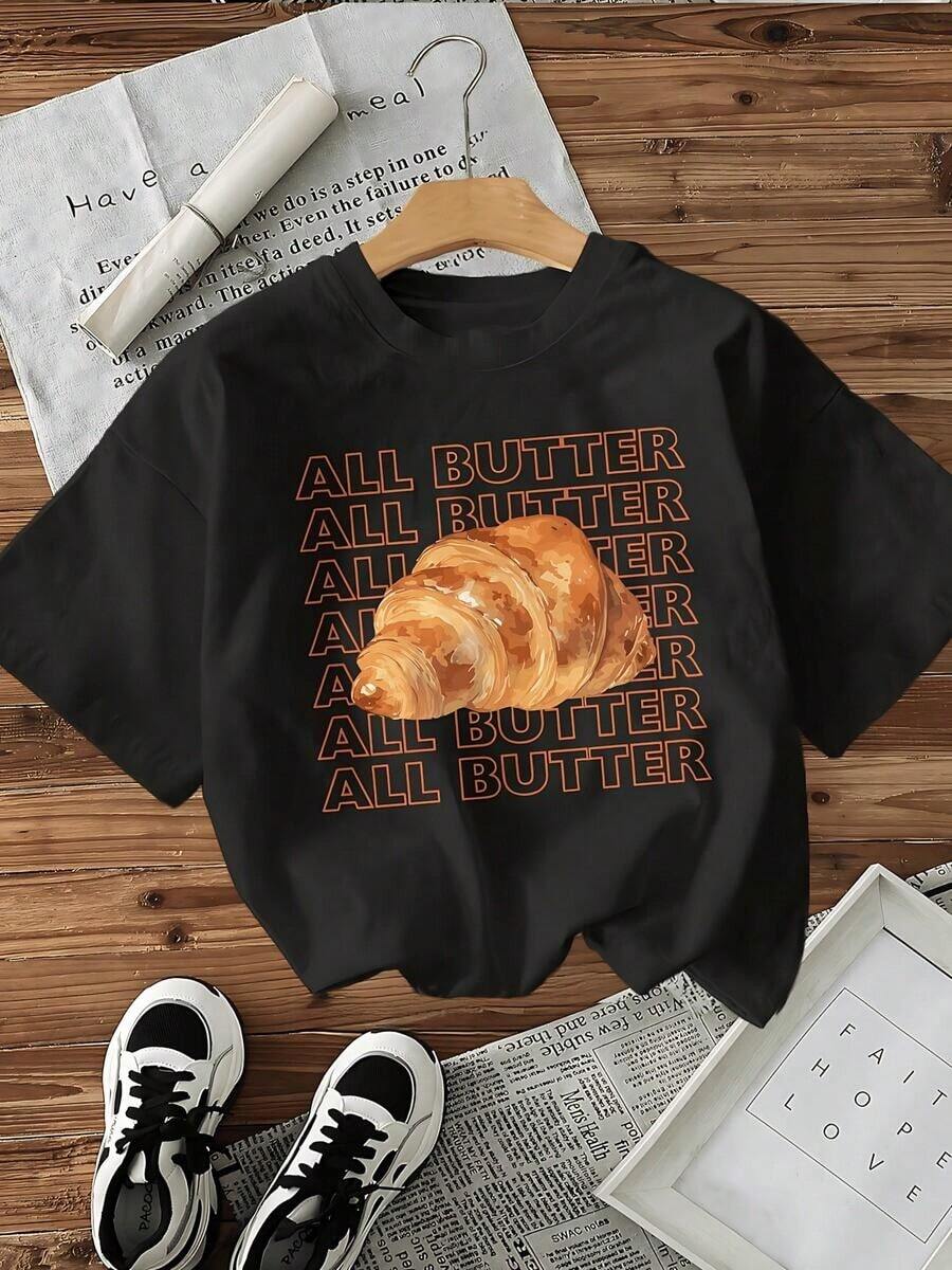 Playera de mujer de algodón suave con estampado gráfico de croissant y texto repetitivo, estilo casual moderno, cuello redondo, manga corta, ideal para uso diario y combinaciones versátiles - Negro - Ver 1