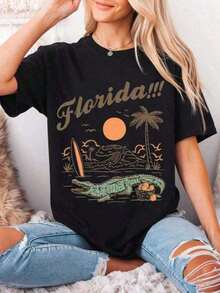 [Entrega Local]Playera Para Mujer [Entrega Local]Playera Para Mujer 2026 Camiseta Estampada de Verano para Mujer, Looks de Playa y Vacaciones, Camiseta con Gráfico de Cocodrilo de Florida, Camiseta Estampada 'Bienvenido a Florida, el Estado del Sol', Top Casual de Manga Corta Retro de Verano para Mujer, Camiseta de Vacaciones Souvenir de Florida, Camiseta Gráfica para Conciertos de Rock, Camiseta de Algodón de Estilo Urbano Vintage, Holgada y Cómoda, Unisex, para Graduación - Negro - Ver 4
