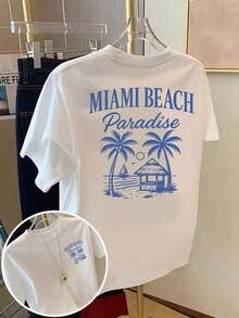 Camiseta de mujer con estética Y2K "MIAMI BEACH Paradise", camiseta de gran tamaño con estampado tropical de playa, estilo casual streetwear, manga corta y cuello redondo, top estampado vintage retro para vacaciones de verano, ropa de playa de verano, ideal para citas informales, brunch, fiestas, moda de vacaciones para adolescentes, camiseta holgada con estampado para mujeres jóvenes y amantes de los viajes. Cómoda y ligera. - Blanco - Ver 1
