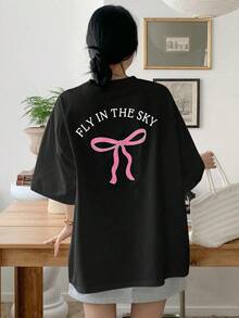 Camiseta de verano para mujer con estampado de lazo y letra, de ajuste holgado y casual, con cuello redondo y mangas caídas, tops lindos y oversize, camisetas gráficas, tops estilo preppy - Negro - Ver 7